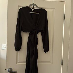 Dress is long with long sleeves.